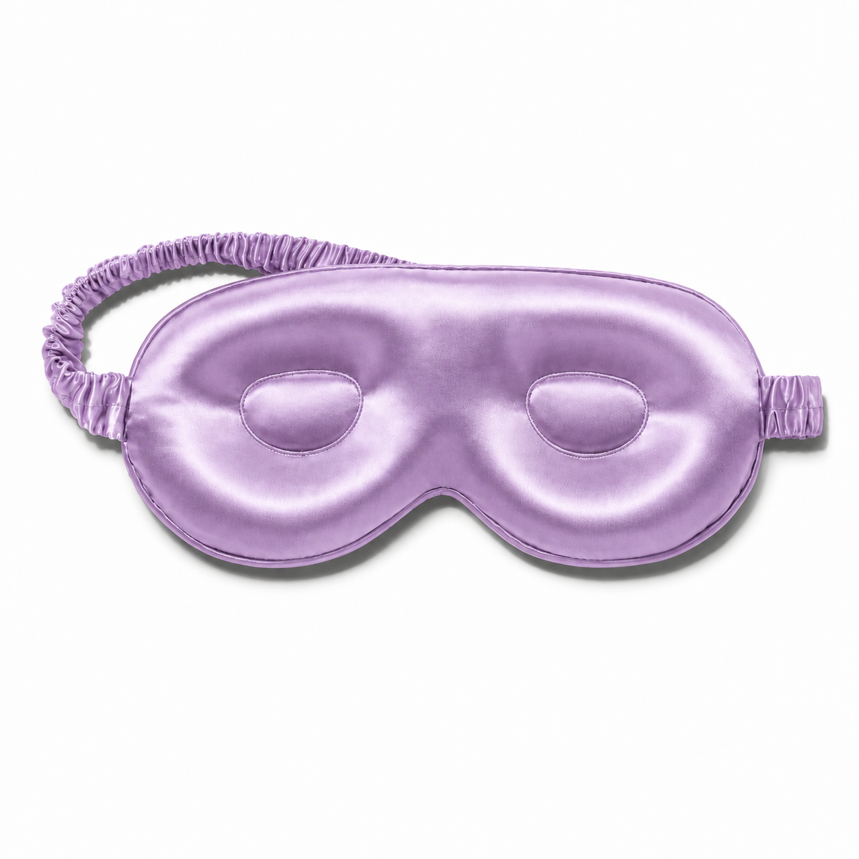 Lavender contoured silk sleep mask with a matching ruched elastic strap, isolated on a plain white background.