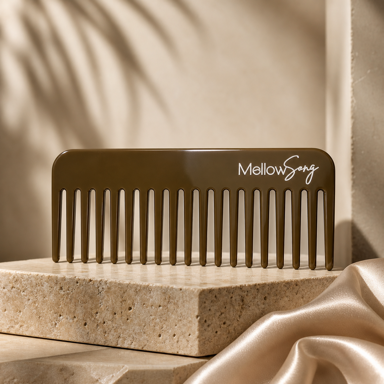 Brown comb with 'MellowSong' branding on a beige stone surface with a soft background