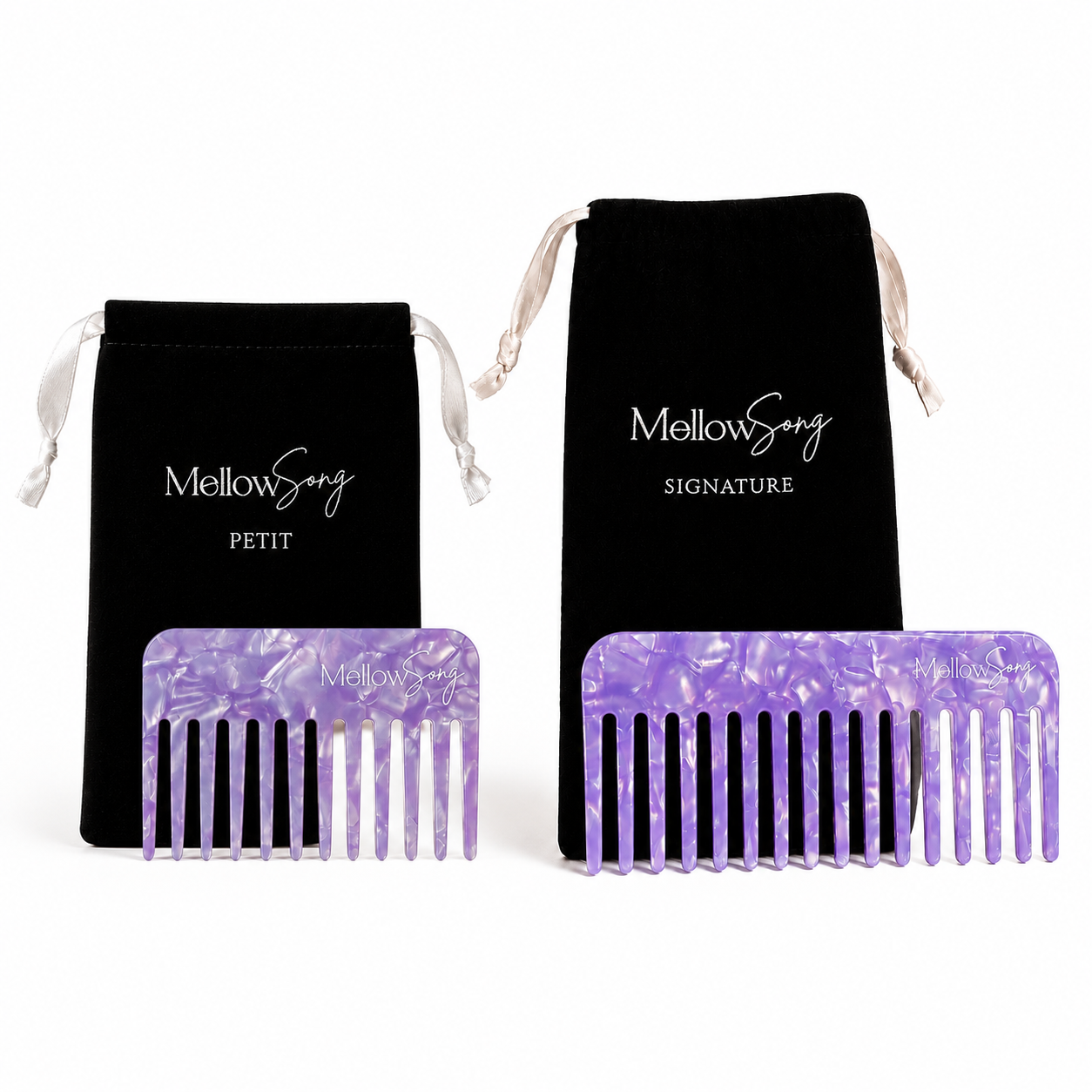 The Duo hair comb set in Iris, both in a purple marbled finish, presented with black velvet travel bags.