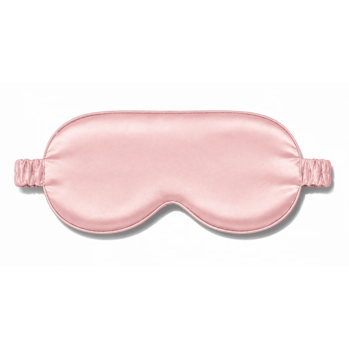 Light pink silk sleep mask with a matching ruched elastic strap, centered against a plain white background.