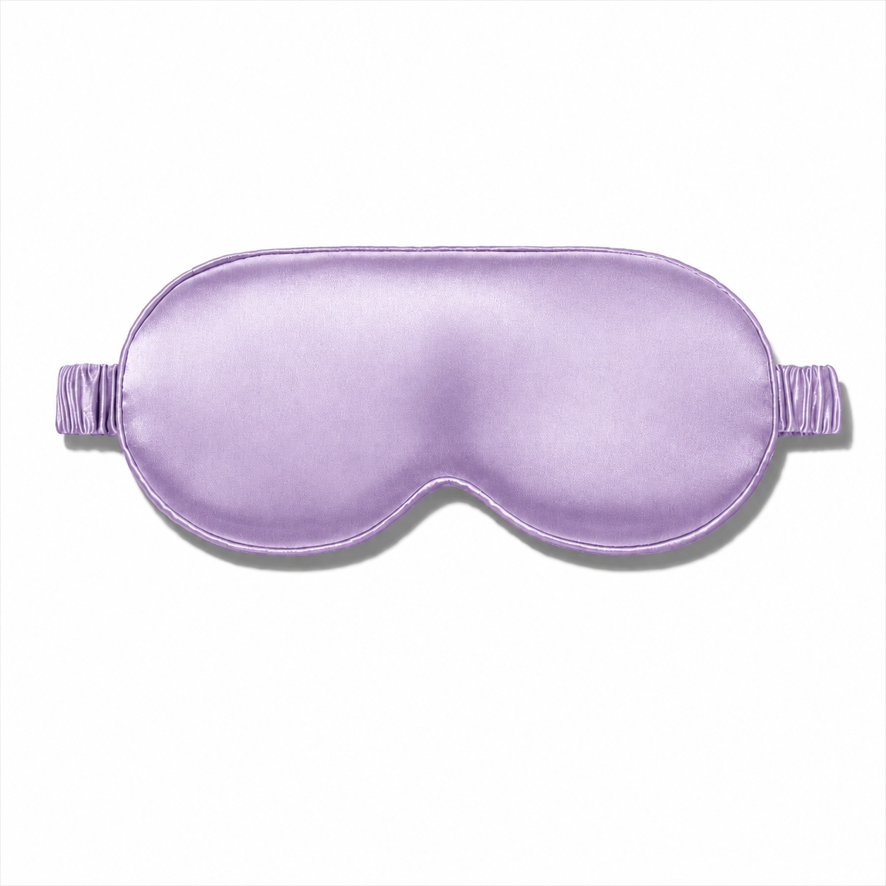 Lavender silk sleep mask with a matching ruched elastic strap, centered against a plain white background.